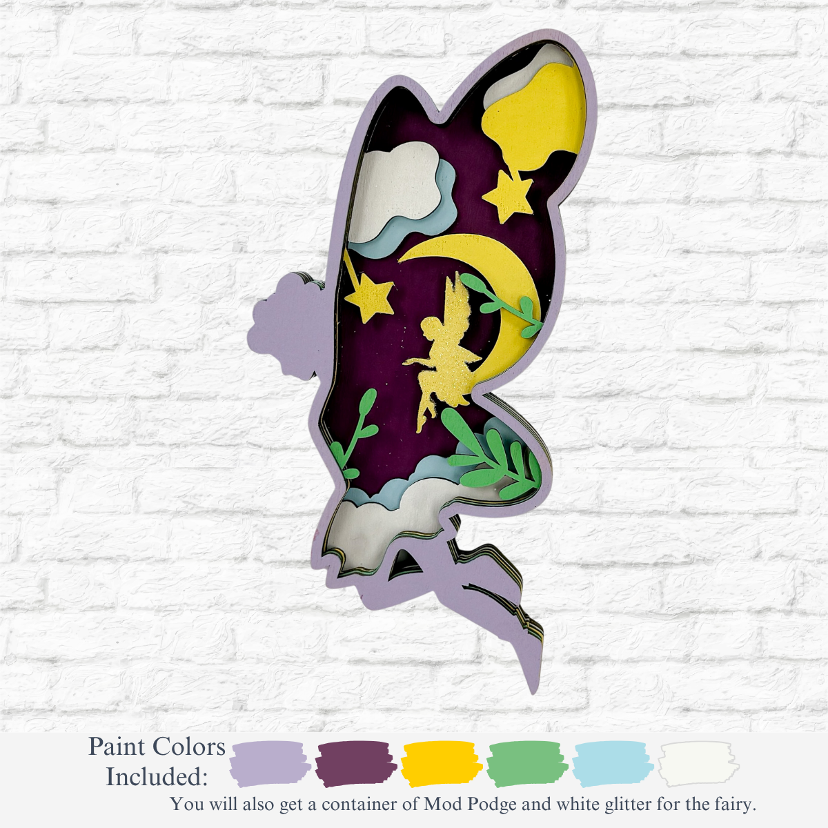 The Rustic Rhode’s DIY 3D Fairy Kids Kit features a laser-cut Baltic Birch fairy silhouette with a night sky scene, plus paint swatches in gray, purple, yellow, green, aqua, and white glitter for creative fun.