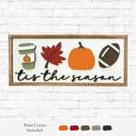 The Rustic Rhode DIY Fall Tis The Season Sign features a wood frame with coffee cup, red leaf, orange pumpkin, and brown football cutouts above "tis the season"—perfect autumn decor or craft project. Paint colors shown below.
