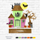 The Rustic Rhode’s DIY Haunted House Kit features a colorful Halloween scene with ghosts, bats, pumpkins, and a spooky tree on a white brick wall. Below are paint color samples and the label “Paint Colors Included.”.