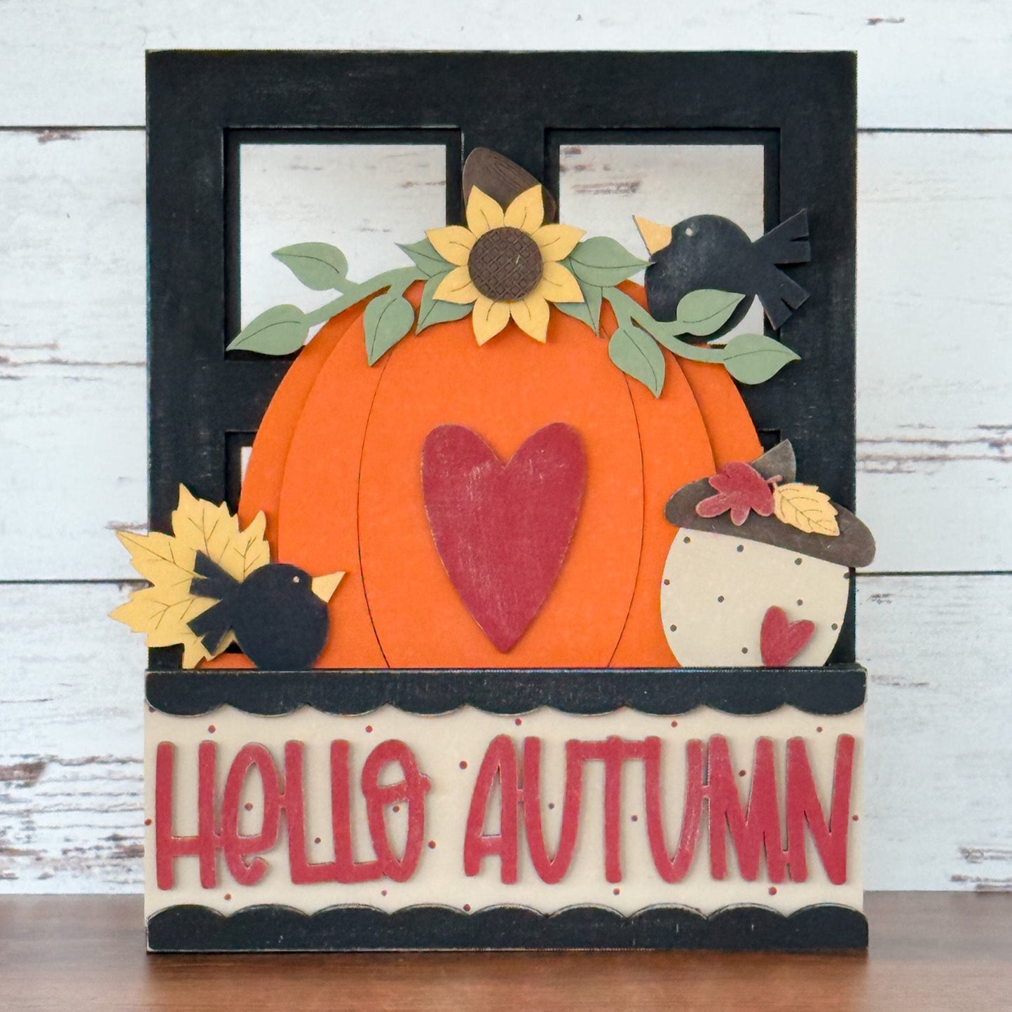 The Rustic Rhode DIY Pumpkin Season 2 Piece Insert features a large orange pumpkin, red heart, sunflowers, leaves, acorns, black birds, and “HELLO AUTUMN” on cream—perfect for your Interchangeable Window Frame or a seasonal DIY display.