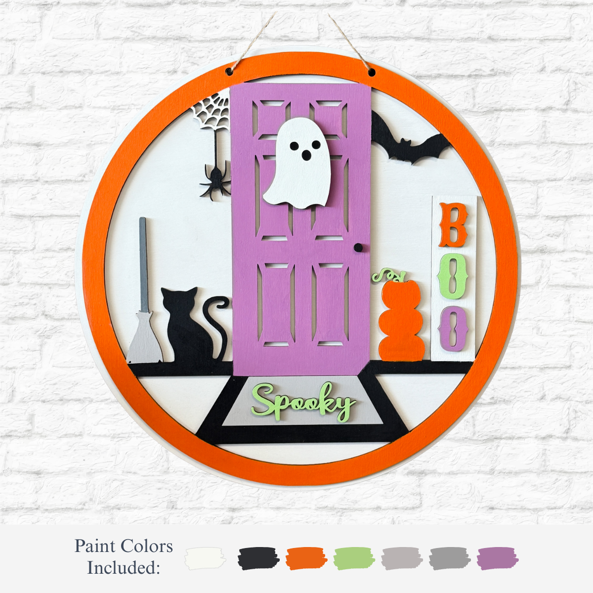 The Rustic Rhode’s DIY Spooky Halloween Porch Door Hanger features an orange border, purple door, ghost, black cat, broom, spider web, bat, pumpkins, "BOO" blocks & "Spooky" text—perfect for spooky porch décor; paint colors shown below.