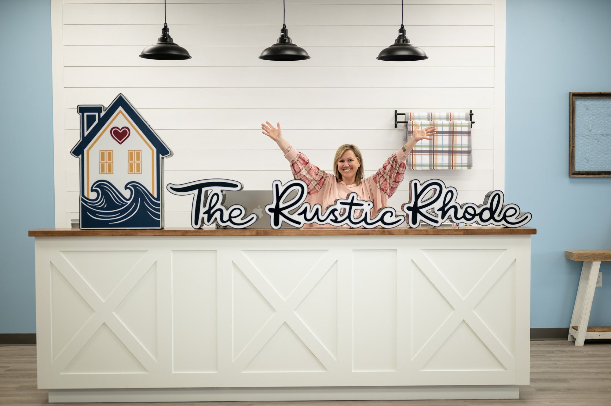 Rustic Rhode founder standing at her Rhode Island craft studio front counter