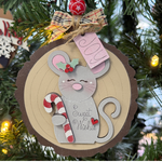 The Rustic Rhode’s DIY Woodland Creatures Ornament—Mouse w/ Candy Cane—includes unassembled pieces to create a cute gray mouse with “Sweet Wishes” on its belly. Perfect for craft lovers to personalize and hang on your tree!.
