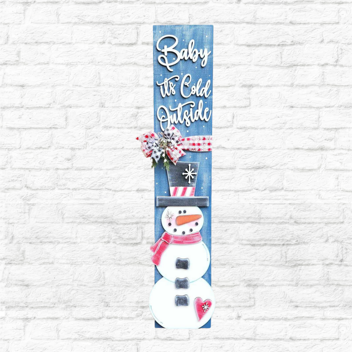 Join Cathy's Craft Night on November 13th at 6:00pm with The Rustic Rhode to create a vertical snowman porch leaner featuring a red scarf, black hat, and “Baby It’s Cold Outside” design, accented with a bow, pinecones, and berries.