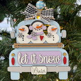 The Rustic Rhode DIY Truck Ornament- Let It Snow features a blue truck with three snowmen, festive signs, and a checked bow—ready to paint and assemble for your Christmas tree.