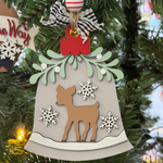 The Rustic Rhode’s DIY Mistletoe Ornament - Reindeer kit includes unassembled pieces inspired by a reindeer, mistletoe, snowflakes, and a red bow—ready to paint and personalize for festive holiday crafting.