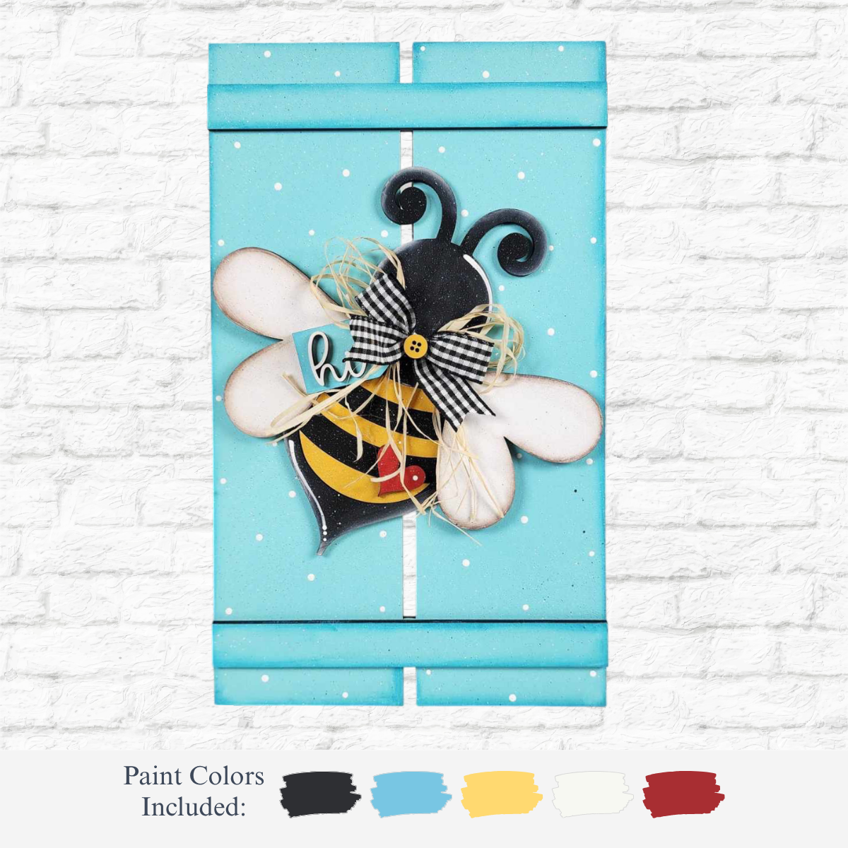 The Rustic Rhode DIY Bee Pallet Sign features a blue, bee-themed wooden sign with white polka dots, a cute bee with a bow and hi sign, plus paint swatches in black, blue, yellow, white, and red for your craft kit.