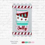 The Rustic Rhode’s DIY Christmas Baking Hanging Sign features three stacked bowls with festive designs and “Jolly” on the red base, framed by a candy cane striped border—perfect holiday décor for your wall.
