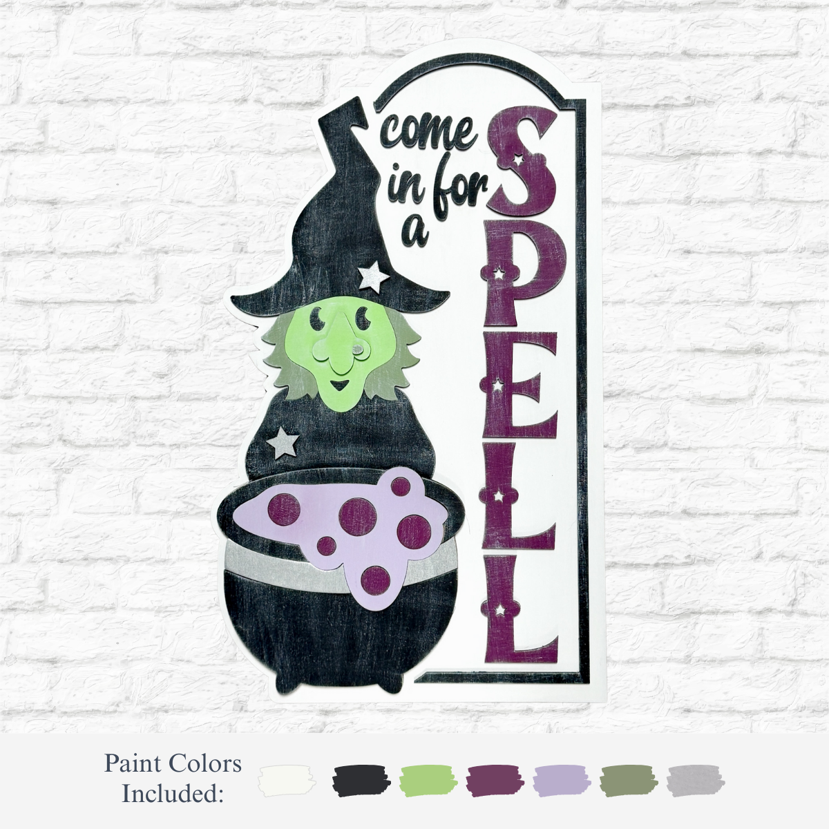 A whimsical green-skinned witch in a black hat stirs a bubbling cauldron beside The Rustic Rhode’s DIY Come In For A Spell Sign, with paint color swatches displayed below on a white brick background.
