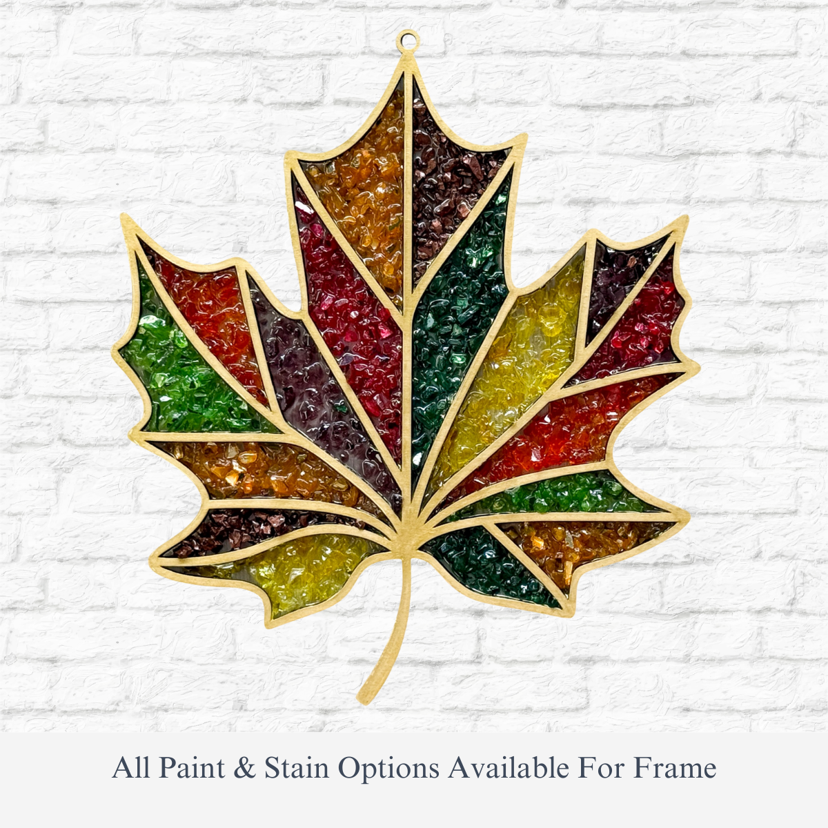 The Rustic Rhode’s DIY Crisp Leaves Faux Suncatcher kit features a maple leaf in red, green, yellow, and brown with gold outlines—perfect for making your own ornament. All paint & stain options are available for the frame.