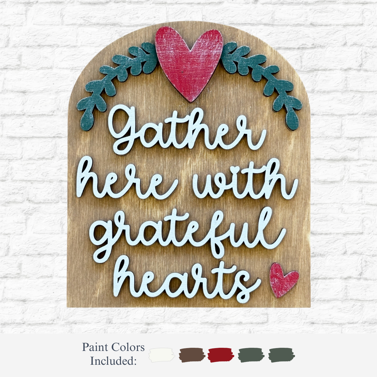 The Rustic Rhode DIY Gather Here Arch Insert features laser-cut Baltic Birch with Gather here with grateful hearts in white script, scalloped frame, red hearts, green leaves, and paint color swatches shown at the bottom.