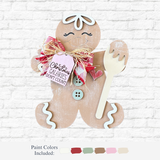 The Rustic Rhode's DIY Gingerbread Calories Don't Count is a wooden figure with icing details, holding a fork and wearing a raffia and fabric bow labeled "Christmas calories don't count"—perfect for festive décor. Paint color samples shown below.