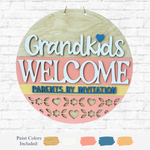 The Rustic Rhode DIY Grandkids Welcome, Parents By Invitation Door Hanger features pastel stripes, a blue heart, decorative cutouts, and floral accents—shown with paint swatches on a white brick background.