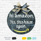 The Rustic Rhode DIY Hi Amazon Door Hanger is a round chalkboard sign with a black and white plaid bow, yellow arrow at the bottom, and paint color swatches with names displayed below for customization.