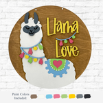 The DIY Llama Love Kids Kit by therusticrhode features a round wooden sign with a smiling white llama, colorful garlands, and a blue blanket with a red heart. “Llama Love” appears in yellow. Includes paint colors for decorating.
