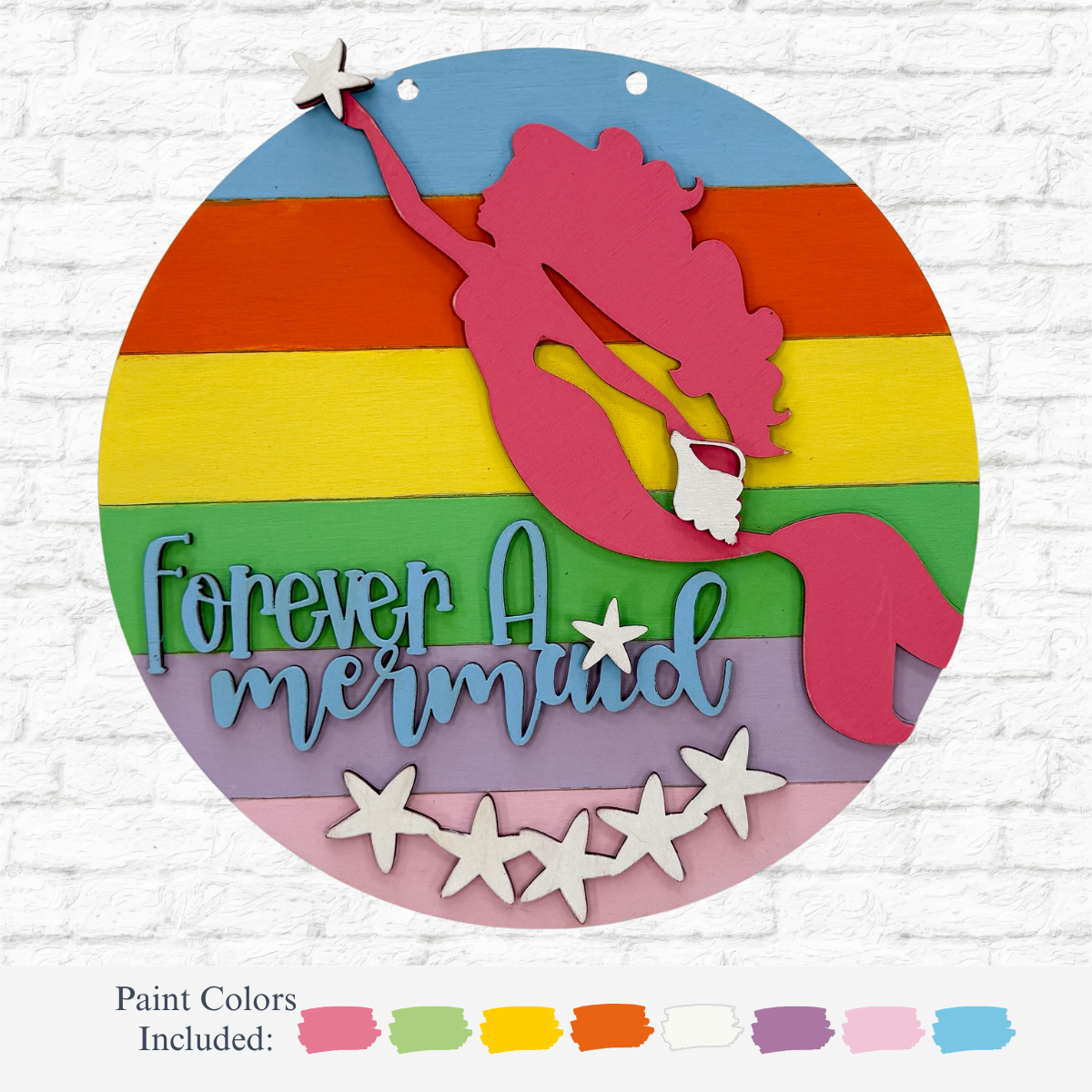 The DIY Mermaid Kids Kit by therusticrhode features a round wooden sign with a rainbow-striped background, pink mermaid silhouette, white starfish, and “Forever a mermaid” in blue and lavender—perfect for fun mermaid crafts! Paint color samples below.