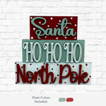 The Rustic Rhode DIY North Pole Santa Word Stacker features three festive sections—“Santa,” “HO HO HO,” and “North Pole”—in red, green, and white. Includes paint colors for a perfect holiday craft kit or Christmas décor project.