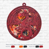The Rustic Rhode’s DIY Paint Pour-Dragon kit features a circular ornament with a cutout dragon, painted in red, black, orange, and white using the pour technique. Paint color options are displayed below against a white brick wall background.