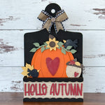 The Rustic Rhode’s DIY Pumpkin Season 2 Piece Insert features a pumpkin with a red heart, sunflowers, leaves, and blackbirds. This Handmade Craft Kit includes a plaid bow and HELLO AUTUMN for your Interchangeable Window Frame.