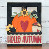 The Rustic Rhode DIY Pumpkin Season 2 Piece Insert features a large orange pumpkin, red heart, sunflowers, leaves, acorns, black birds, and “HELLO AUTUMN” on cream—perfect for your Interchangeable Window Frame or a seasonal DIY display.
