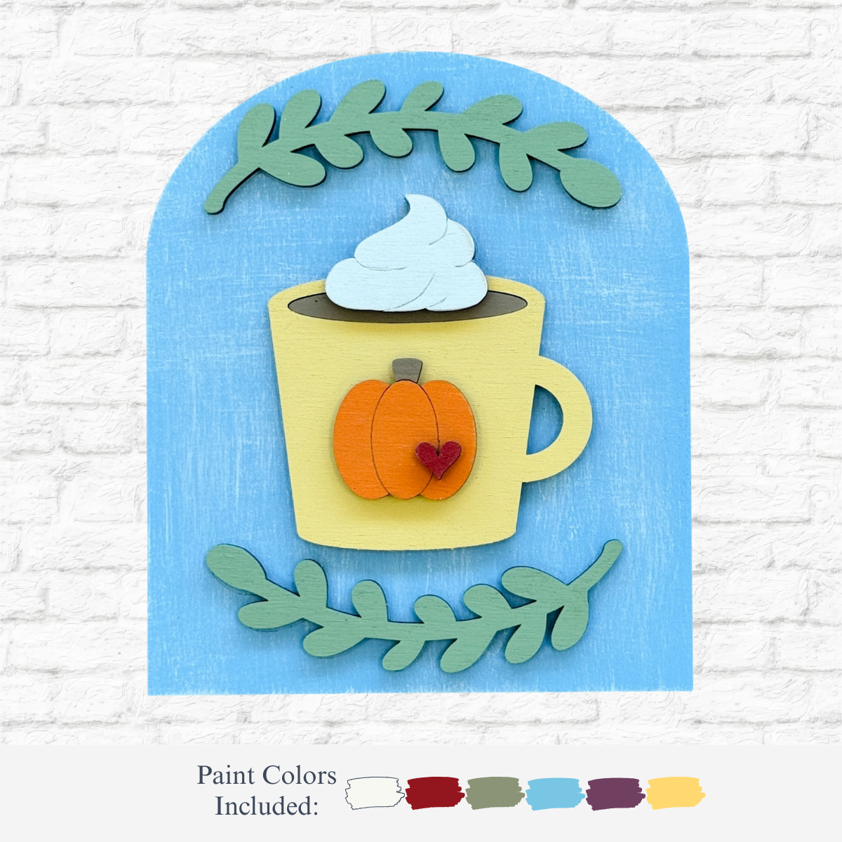 The Rustic Rhodes DIY Pumpkin Spice Arch Insert features a yellow mug with a pumpkin and heart atop whipped cream on blue, framed by green leaves—perfect for fall décor. Paint colors used are displayed below the image.