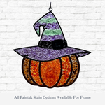 The Rustic Rhode DIY Pumpkin Witch Faux Suncatcher, shaped like a pumpkin in a striped purple witch hat, hangs on a white brick wall as festive Halloween window decor. All paint and stain options available for the frame.