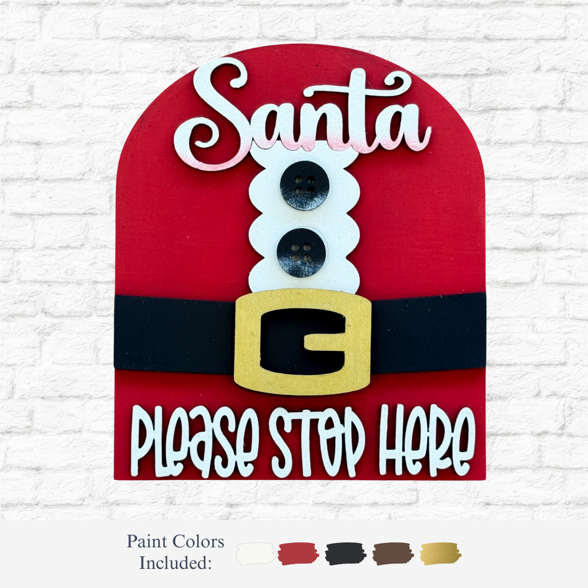 The Rustic Rhode DIY Santa Stop Here Arch Insert features a red and white scalloped arch shaped like Santa’s suit with Santa at the top, please stop here at the bottom, black buttons, a belt with gold buckle, and paint colors for festive décor.