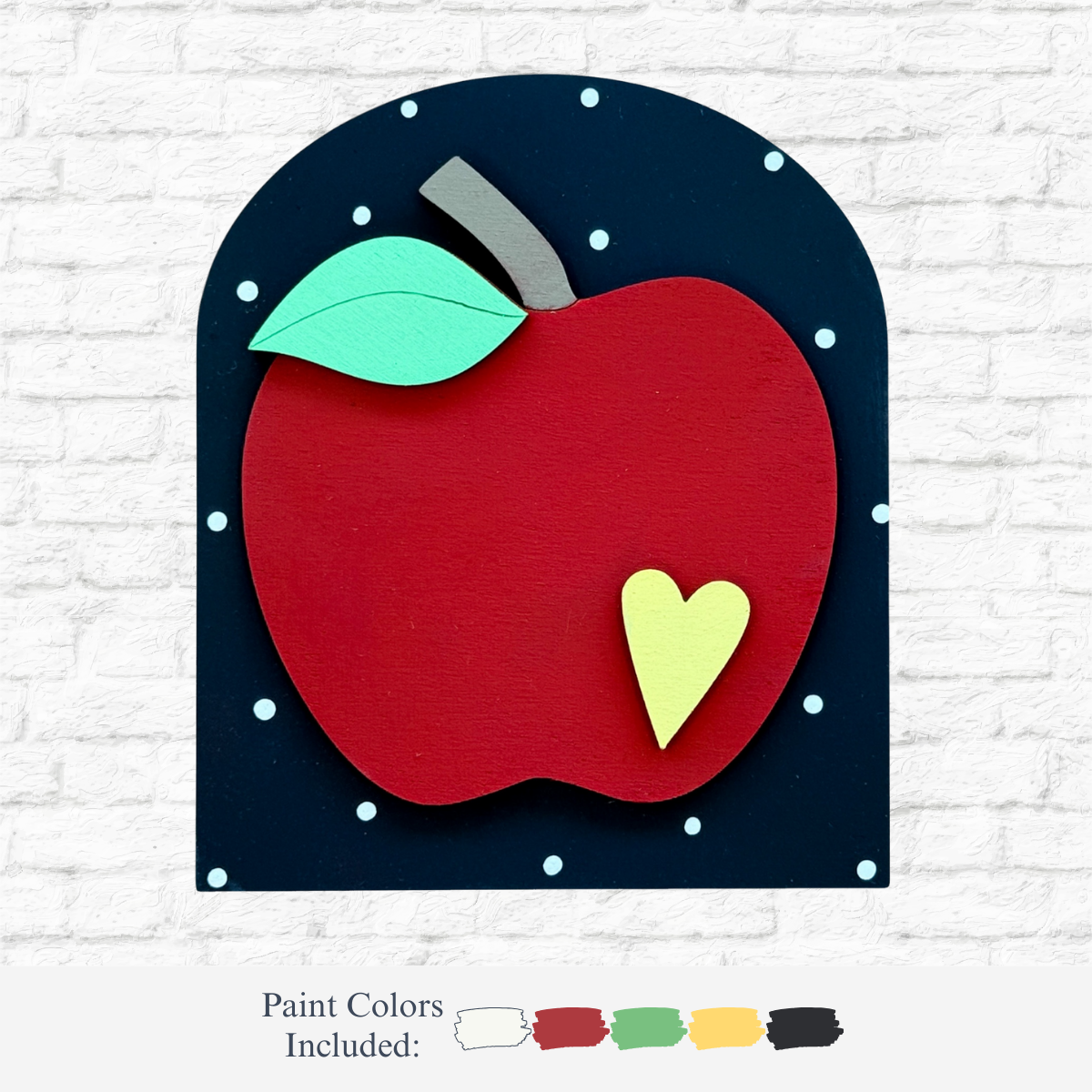 The Rustic Rhode DIY Teachers Apple Arch Insert features a red apple with a green leaf and yellow heart on a black arch with white dots, plus five paint colors—perfect for handmade classroom decor or your Scalloped Arch Insert Frame.