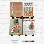 The Rustic Rhode’s DIY Victorian Gingerbread Sign Quartet features four festive signs with spice words, a house, and a cookie recipe—perfect holiday décor in green, red, tan, brown, and white.