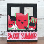 Add a splash of summer to your Breadboard or Interchangeable Window Frame with The Rustic Rhodes DIY Watermelon Summer 2 Piece Insert, featuring watermelon slices, black birds, hearts, and bold pink “SWEET SUMMER” lettering.