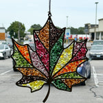 The Rustic Rhode's Autumn Magic Suncatchers Workshop features a stained glass maple leaf in red, yellow, green, and orange—perfect for fall crafts and gorgeous in a window overlooking autumn scenery.