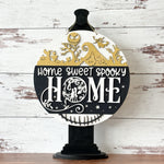 The Rustic Rhode’s “This is Halloween…Craft Night!” sign features gold silhouettes of haunted houses and trees, plus "Home Sweet Spooky Home" in bold white and black. Ideal for Nightmare Before Christmas workshops or Halloween crafts.