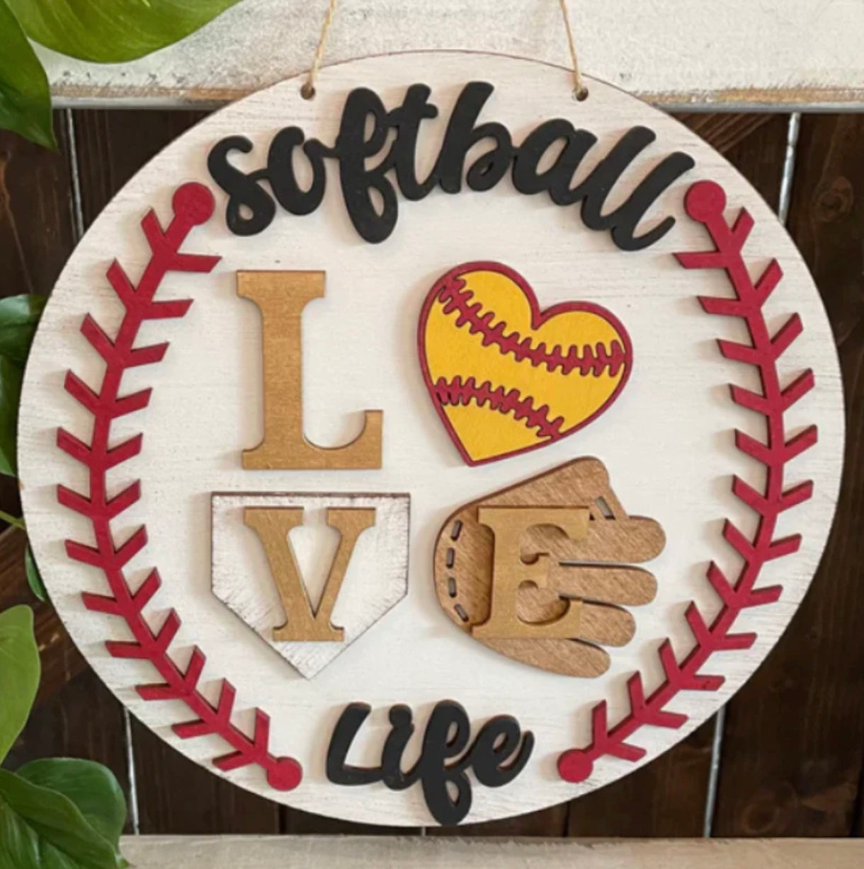 Show support with The Rustic Rhode’s “Softball Life” door hanger—features red softball stitching, “LOVE” with a heart-shaped softball, glove, and wood letters on a home plate. Perfect for the Warwick Softball Fundraiser-10/2/25!.